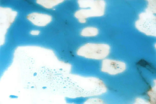 Untreated marble stained by blue dye